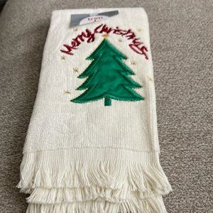 Folded into 8 inch by 4 inch Christmas towel